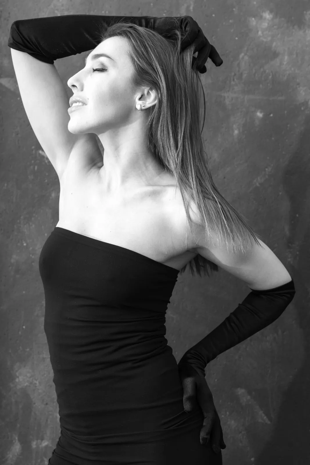 Wolford's Fatal, a circular-knit tube dress, with long gloves, in black and white