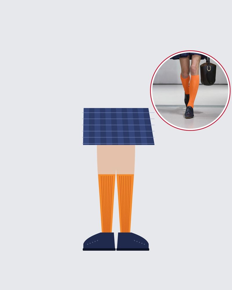 Illustration: ribbed orange knee-highs and navy brogues under a navy check pleated mini skirt, with a photo of the runway look